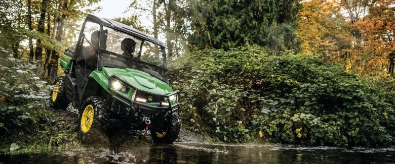 A 2021 John Deere gator crosses a creek